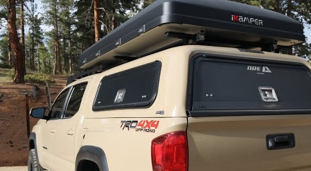 A split image showing an overlanding truck with a roof top tent next to a truck bed camping setup with a fiberglass cap.